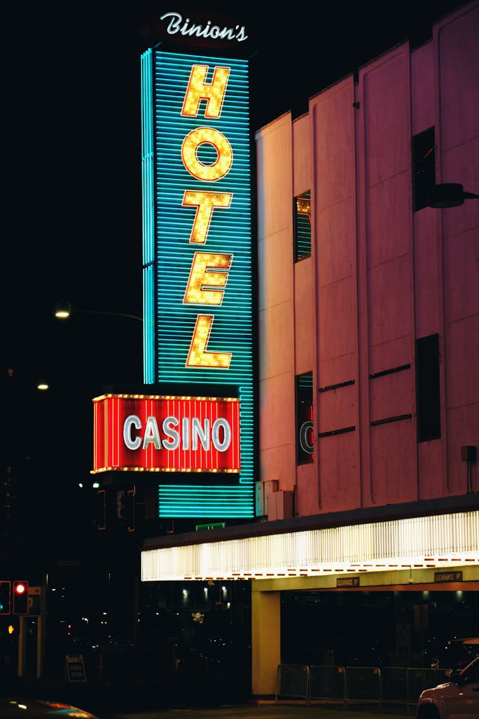 Neon-lit Casino and Hotel sign at night in downtown Las Vegas, showcasing vivid colors and urban nightlife.